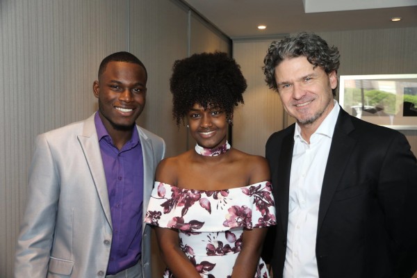 Dave Eggers with student emcees Sadrack and Betty