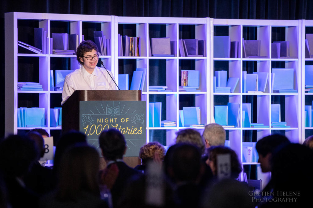 Cristian speaking at a podium.