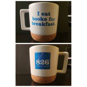 Two pictures showcase the white I eat books for breakfast mug. The mug has a cork bottom with the blue text on one side and the blue 826 boston logo on the other.